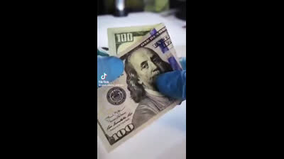 Le Billet de 100$ sous microscope